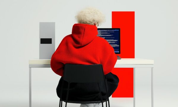 Person in Red Hoodie Coding Person in Red Hoodie Coding